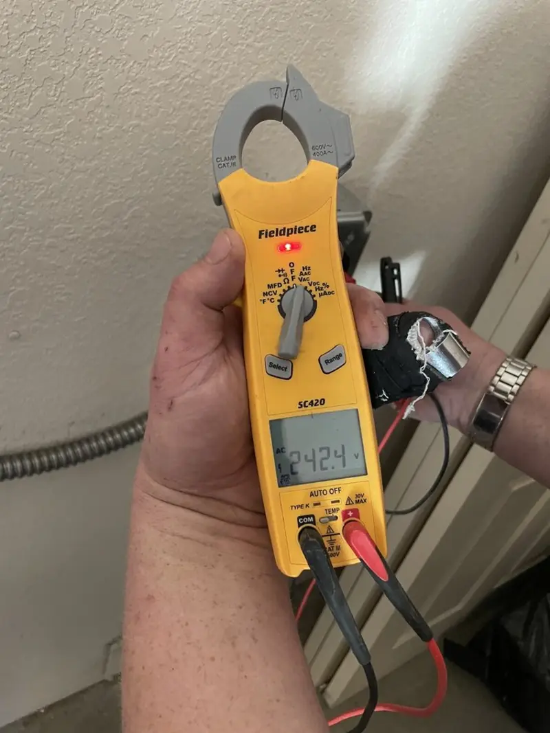 Voltage testing with clamp meter during Ceiling Fan Installation in Pocopson
